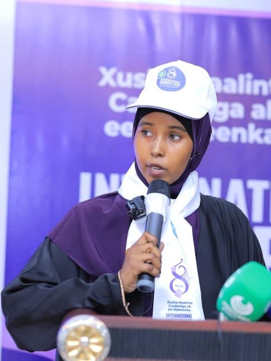 A young woman speaking at the International Women's Day 2026 event
